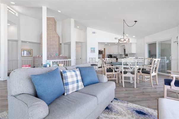 Chandelier, Dining room, Interior, Kitchen, Living room, Pendant Lights, Recessed Lighting, Stainless Steel Appliances, Wood Texture Flooring