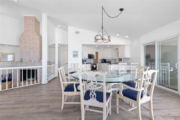 Chandelier, Dining room, Interior, Kitchen, Pendant Lights, Recessed Lighting, Stainless Steel Appliances, Wood Texture Flooring