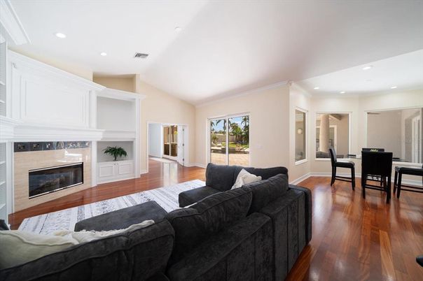 Dining room, Fireplace, Interior, Living room, Recessed Lighting, Wood Texture Flooring