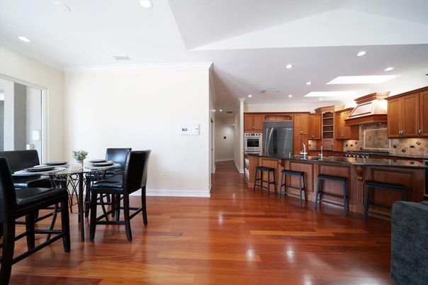 Dining room, Interior, Kitchen, Recessed Lighting, Stainless Steel Appliances, Wood Texture Flooring