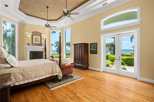 Bedroom, Fireplace, Interior, Recessed Lighting, Water, Wood Texture Flooring