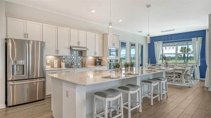Dining room, Interior, Kitchen, Pendant Lights, Recessed Lighting, Stainless Steel Appliances, Wood Texture Flooring