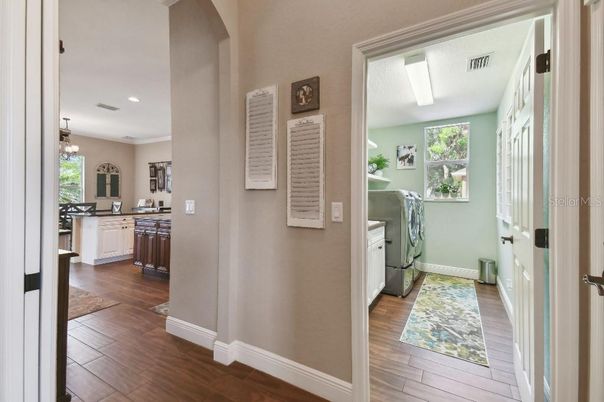 Interior, Kitchen, Recessed Lighting, Washer, Wood Texture Flooring