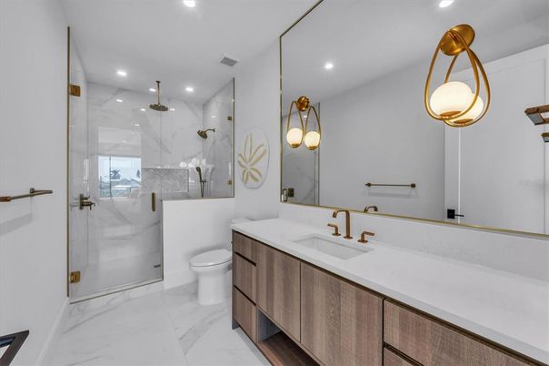 Bathroom, Dual Sink Vanities, Glass Shower, Interior, Marble, Marble Walls, Recessed Lighting