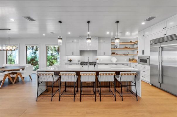 Dining room, Interior, Kitchen, Pendant Lights, Recessed Lighting, Stainless Steel Appliances, Wood Texture Flooring
