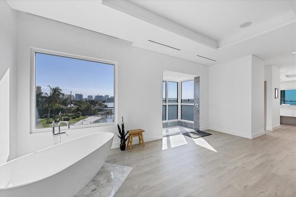 Bathroom, Free Standing Baths, Interior, Recessed Lighting, Water, Wood Texture Flooring