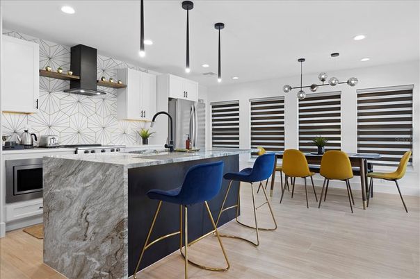 Interior, Kitchen, Marble Walls, Pendant Lights, Recessed Lighting, Stainless Steel Appliances, Wood Texture Flooring
