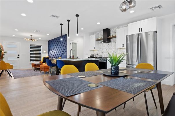 Dining room, Interior, Kitchen, Pendant Lights, Recessed Lighting, Stainless Steel Appliances, Wood Texture Flooring