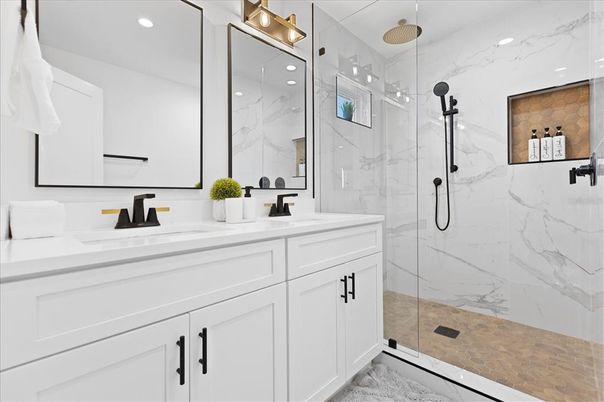 Bathroom, Dual Sink Vanities, Glass Shower, Interior, Marble Walls, Recessed Lighting