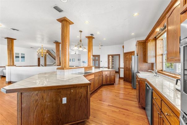 Interior, Kitchen, Pendant Lights, Recessed Lighting, Tile Countertops, Wood Texture Flooring