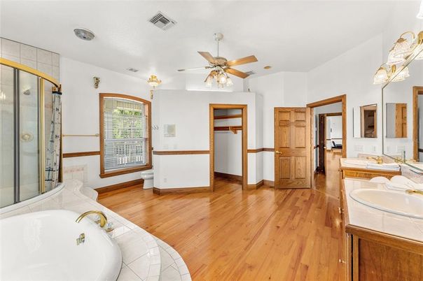 Bathroom, Dual Sink Vanities, Glass Shower, Interior, Tile Countertops, Wood Texture Flooring