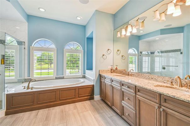 Bathroom, Dual Sink Vanities, Glass Shower, Interior, Recessed Lighting, Wood Texture Flooring