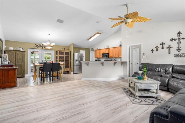 Chandelier, Dining room, Interior, Kitchen, Living room, Stainless Steel Appliances, Wood Texture Flooring