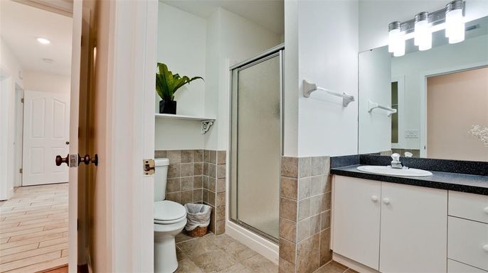 Bathroom, Glass Shower, Interior, Recessed Lighting, Wood Texture Flooring