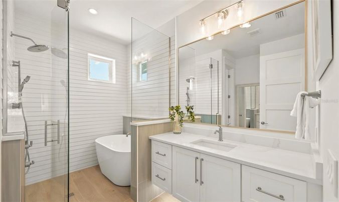 Bathroom, Free Standing Baths, Glass Shower, Interior, Recessed Lighting, Wood Texture Flooring