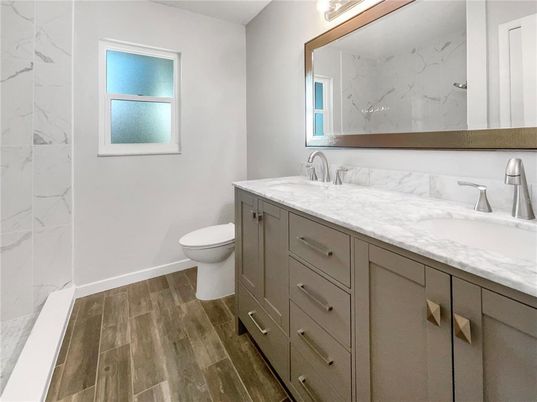 Bathroom, Dual Sink Vanities, Interior, Marble Walls, Wood Texture Flooring