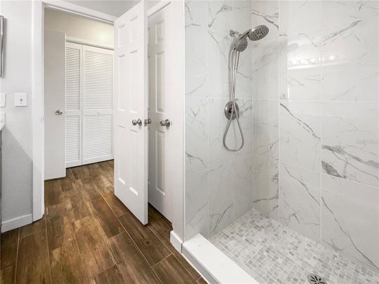 Bathroom, Glass Shower, Interior, Marble Walls, Wood Texture Flooring