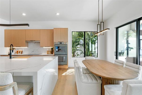 Dining room, Interior, Kitchen, Pendant Lights, Recessed Lighting, Stainless Steel Appliances, Wood Texture Flooring