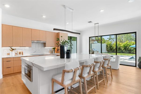 Interior, Kitchen, Marble Walls, Pendant Lights, Recessed Lighting, Wood Texture Flooring