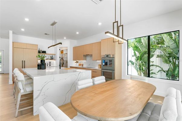 Dining room, Interior, Kitchen, Pendant Lights, Recessed Lighting, Stainless Steel Appliances, Wood Texture Flooring
