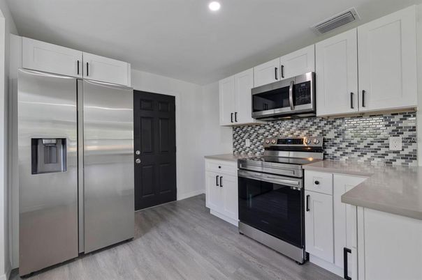 Interior, Kitchen, Recessed Lighting, Stainless Steel Appliances, Wood Texture Flooring