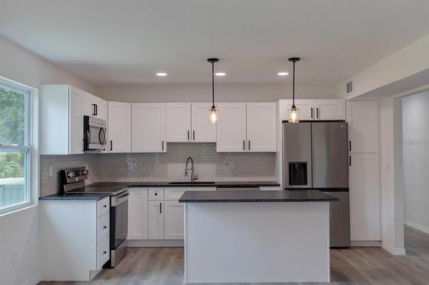 Interior, Kitchen, Pendant Lights, Recessed Lighting, Stainless Steel Appliances, Wood Texture Flooring