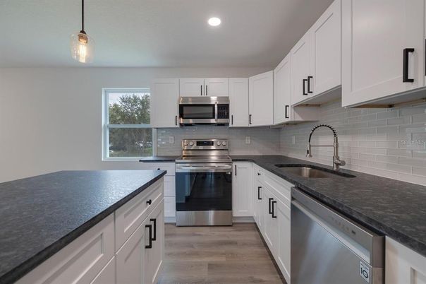 Interior, Kitchen, Pendant Lights, Recessed Lighting, Stainless Steel Appliances, Wood Texture Flooring