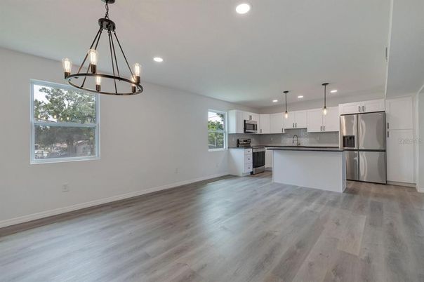 Chandelier, Interior, Kitchen, Pendant Lights, Recessed Lighting, Stainless Steel Appliances, Wood Texture Flooring
