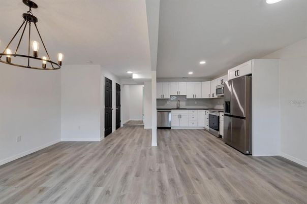 Chandelier, Interior, Kitchen, Pendant Lights, Recessed Lighting, Stainless Steel Appliances, Wood Texture Flooring