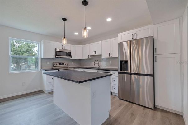 Interior, Kitchen, Pendant Lights, Recessed Lighting, Stainless Steel Appliances, Wood Texture Flooring