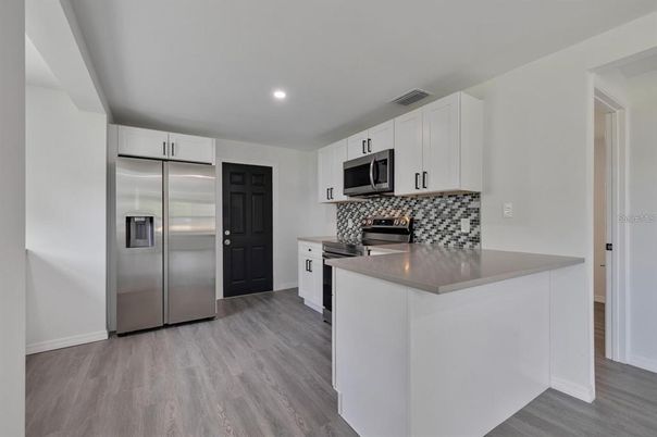 Interior, Kitchen, Recessed Lighting, Stainless Steel Appliances, Wood Texture Flooring