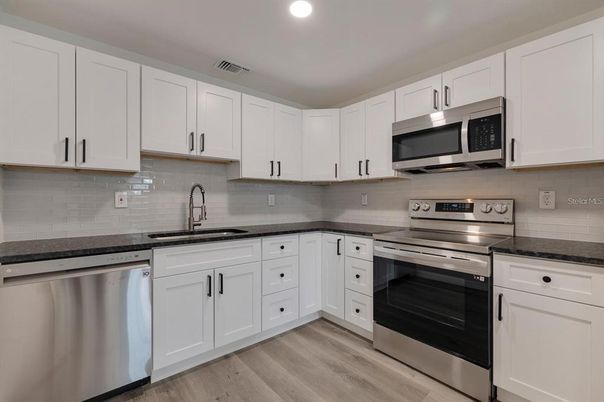 Interior, Kitchen, Recessed Lighting, Stainless Steel Appliances, Wood Texture Flooring