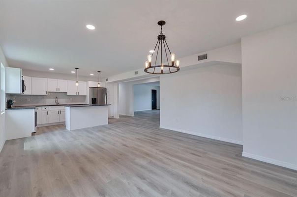 Chandelier, Interior, Kitchen, Pendant Lights, Recessed Lighting, Stainless Steel Appliances, Wood Texture Flooring