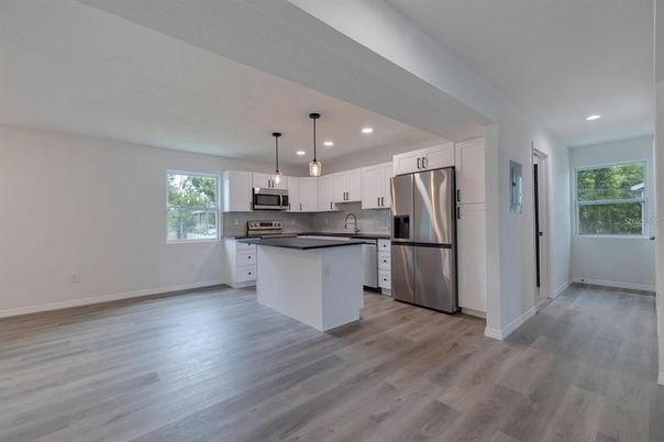 Interior, Kitchen, Pendant Lights, Recessed Lighting, Stainless Steel Appliances, Wood Texture Flooring