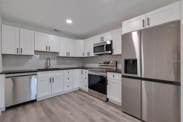 Interior, Kitchen, Recessed Lighting, Stainless Steel Appliances, Wood Texture Flooring