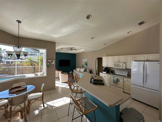 Chandelier, Dining room, Interior, Kitchen, Living room, Pendant Lights, Recessed Lighting, Stainless Steel Appliances