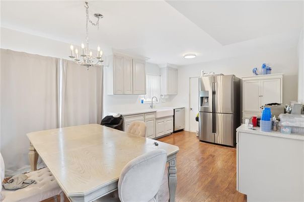 Chandelier, Dining room, Interior, Kitchen, Stainless Steel Appliances, Wood Texture Flooring