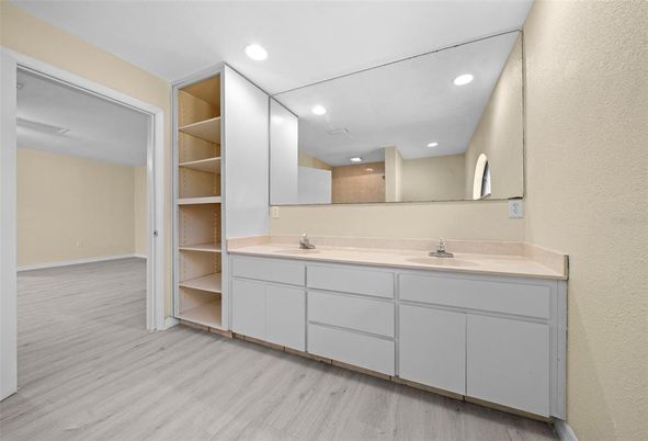 Bathroom, Dual Sink Vanities, Interior, Recessed Lighting, Wood Texture Flooring