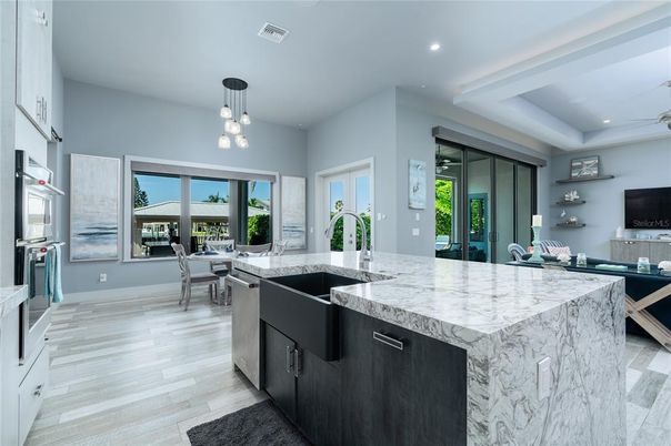 Dining room, Interior, Kitchen, Pendant Lights, Recessed Lighting, Stainless Steel Appliances, Wood Texture Flooring