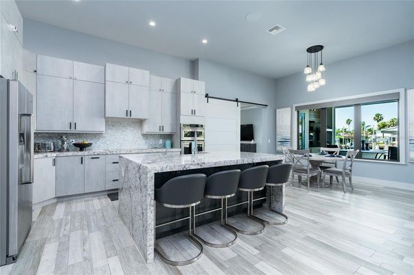 Dining room, Interior, Kitchen, Pendant Lights, Recessed Lighting, Stainless Steel Appliances, Wood Texture Flooring