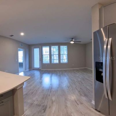 Empty room, Interior, Kitchen, Recessed Lighting, Stainless Steel Appliances, Wood Texture Flooring