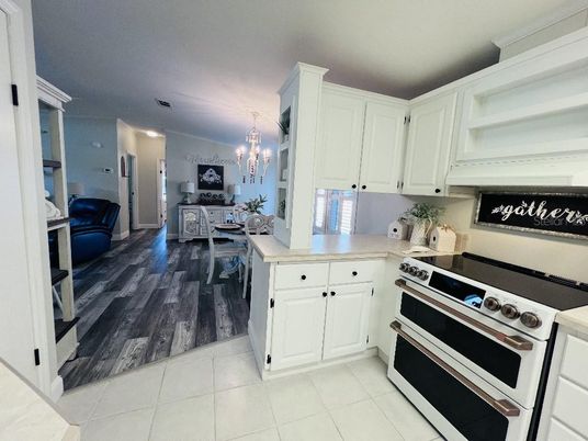 Chandelier, Dining room, Interior, Kitchen, Stainless Steel Appliances, Wood Texture Flooring