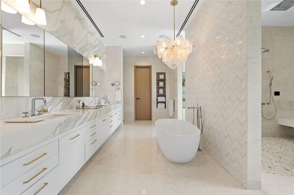 Bathroom, Chandelier, Dual Sink Vanities, Free Standing Baths, Interior, Marble, Marble Walls, Pendant Lights, Recessed Lighting