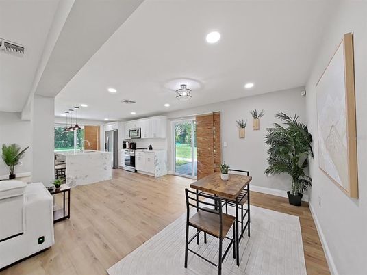 Dining room, Interior, Kitchen, Pendant Lights, Recessed Lighting, Stainless Steel Appliances, Wood Texture Flooring