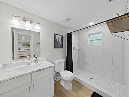 Bathroom, Glass Shower, Interior, Marble Walls, Recessed Lighting, Wood Texture Flooring