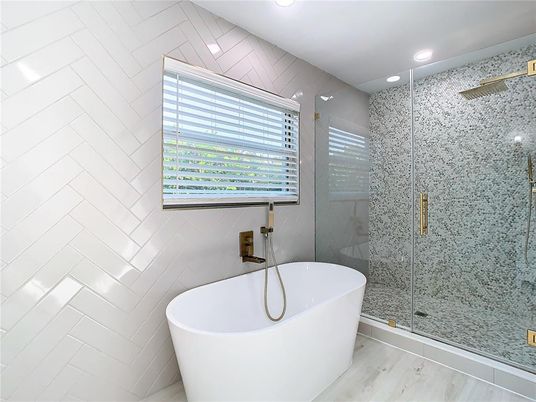 Bathroom, Free Standing Baths, Glass Shower, Interior, Recessed Lighting, Wood Texture Flooring