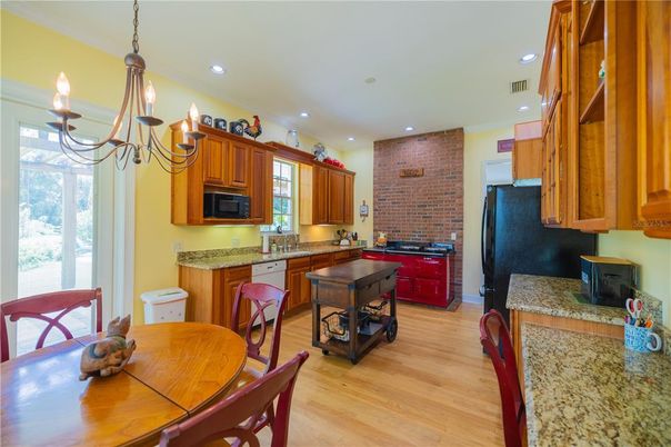 Dining room, Interior, Kitchen, Pendant Lights, Recessed Lighting, Stainless Steel Appliances, Stone Walls, Wood Texture Flooring