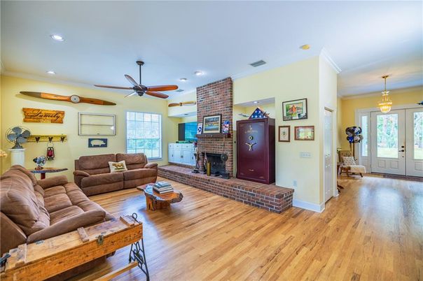 Fireplace, Interior, Living room, Recessed Lighting, Stone Walls, Wood Texture Flooring