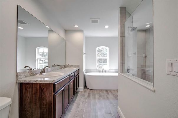 Bathroom, Dual Sink Vanities, Free Standing Baths, Glass Shower, Interior, Recessed Lighting, Wood Texture Flooring