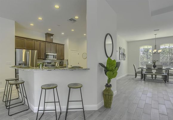Chandelier, Dining room, Interior, Kitchen, Recessed Lighting, Stainless Steel Appliances, Wood Texture Flooring